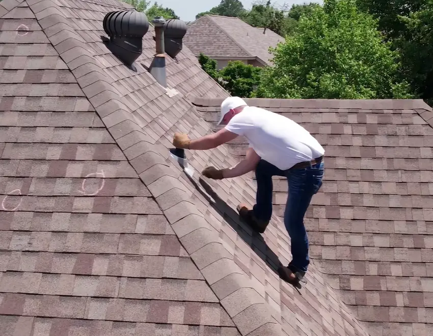 expert roofer inspecting shingles after Florida storm