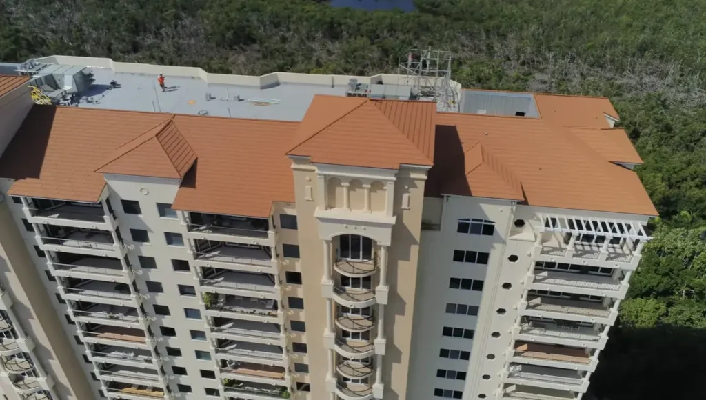 High-rise commercial building featuring a clean, terracotta-colored premium tile roof system.
