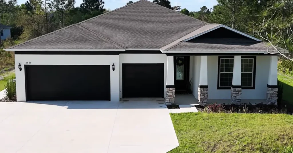 Modern Gainesville home featuring a newly installed dark asphalt shingle roof system