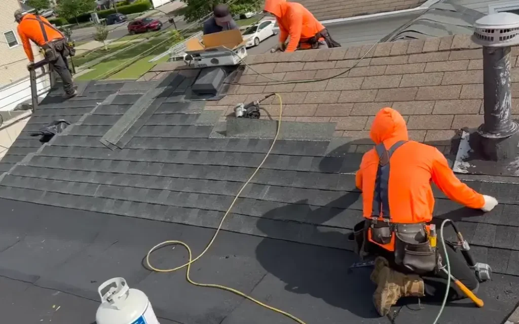 A professional roofing crew installing architectural shingles on a residential home in Gainesville